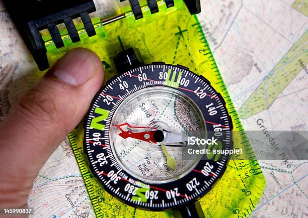 Hand And Compass On Map Stock Photo - Download Image Now - Adult, Behind, Blue