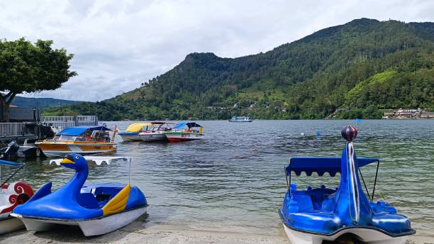 Lake Toba 2 One of the beaches on Lake Toba which is usually used by tourists on vacation, bathing and swimming. lake toba indonesia stock pictures, royalty-free photos & images