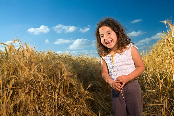istock little girl in a wheat field 145991140
