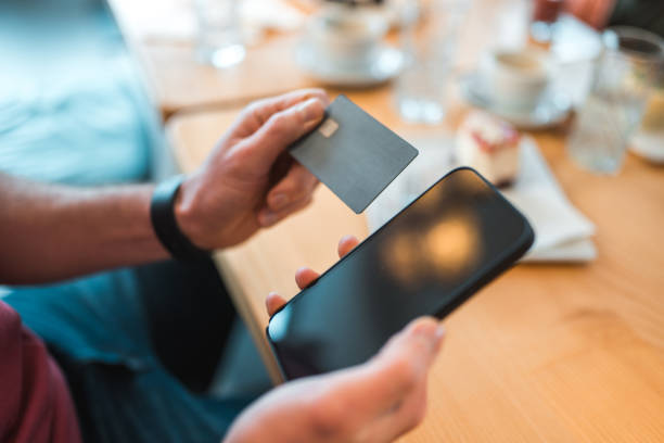 istock Caucasian Male Using Smartphone In A Cafe 1459915420