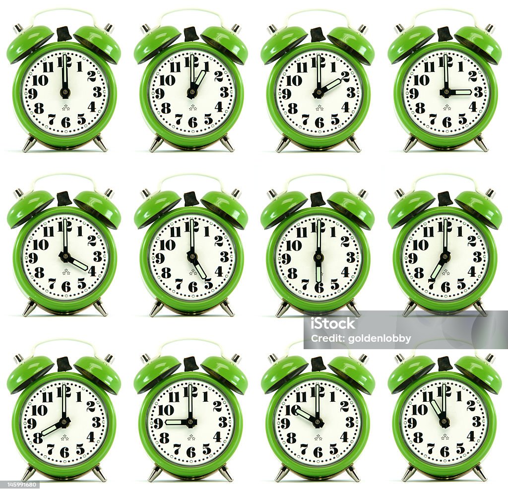 twelve hours alarm clock classic small alarm clock twelve hours isolated on white background multiple image Alarm Clock Stock Photo