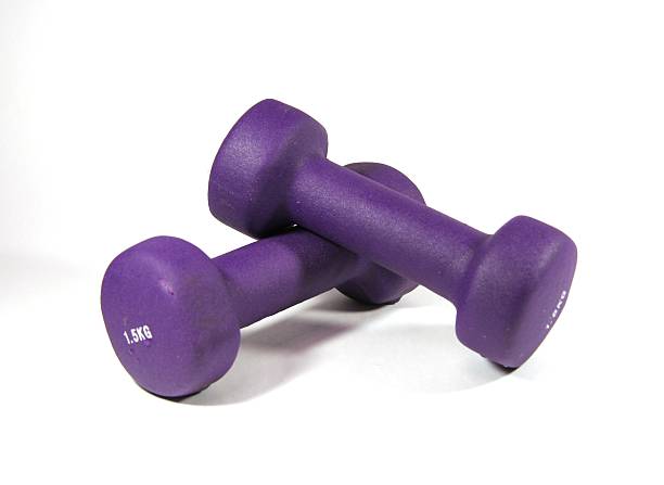 istock Two dumbbells of violet color 145991917
