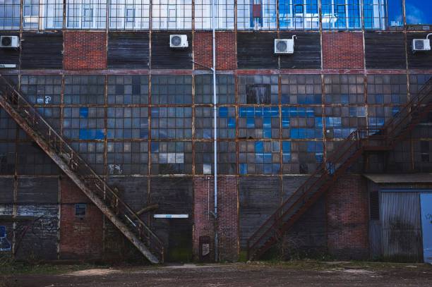 istock View of an old industrial storage building with small windows 1459921445