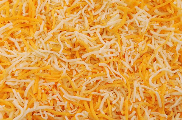 Grated Cheese Grated Cheese colby cheddar stock pictures, royalty-free photos & images