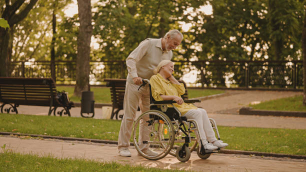 istock Loving senior husband supporting wife with disability, marriage harmony 1459922888