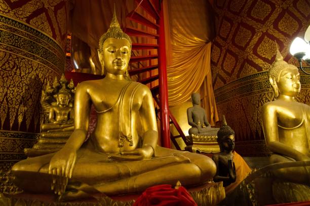 istock Golden Buddhas inside the Wat Phanan Choeng in Ayutthaya, Thailand 1459926578