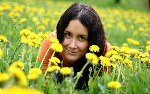 Beautiful girl lying on grass. stock photo