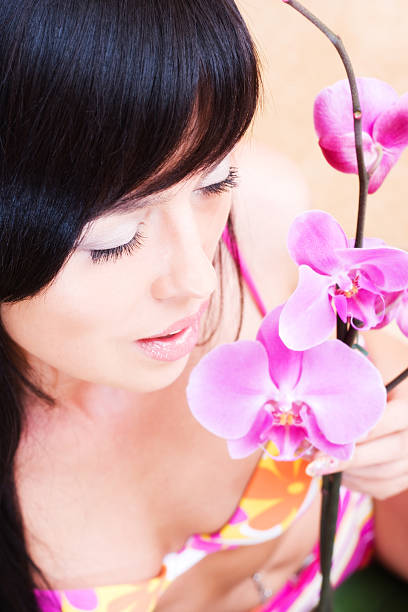 istock Asian girl with orchid 145992876
