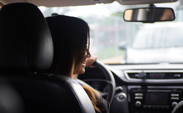 istock Hispanic female driving a car 1459929397