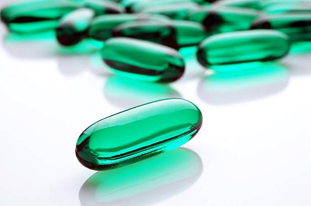 Green capsules stock photo