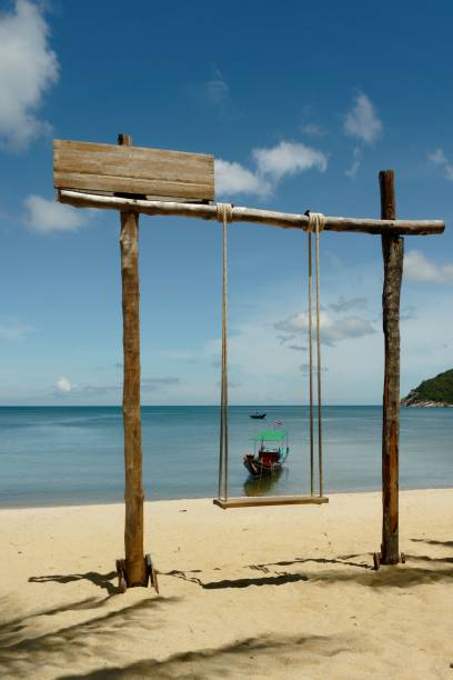 istock Swing at a sandy beach on a sunny morning 1459930119