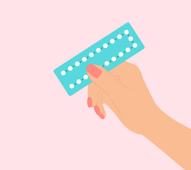 Female Hand Holding Birth Control Pills On Pink Background Female Hand Holding Birth Control Pills On Pink Background oestrogen stock illustrations