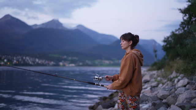 Woman fishing in Norway