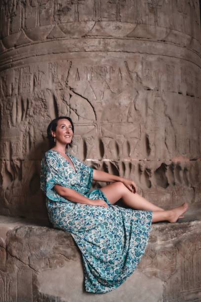 istock Vertical of a woman resting in an ancient pyramid in Egypt 1459930898