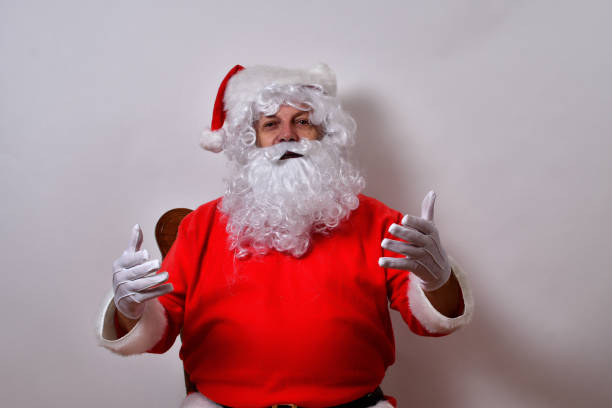 istock Happy American Santa Claus posing on white background 1459931024