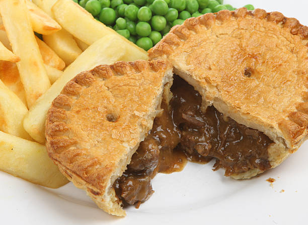 istock Steak and kidney pie with chips and peas 145993218