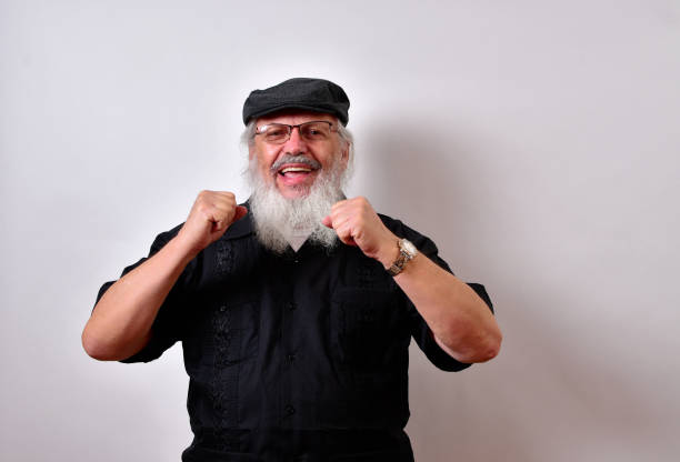 istock Happy old man is smiling and waving his hands 1459934408