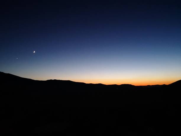 istock Silhouette shot of mountain landscape under a sunset sky 1459934698