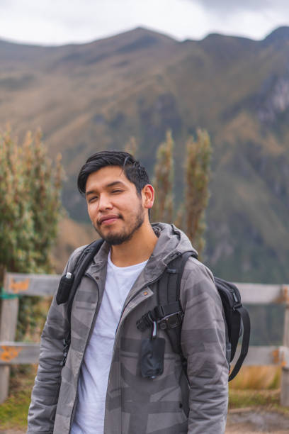 istock Young guy hiking in mountains and enjoying the beautiful view 1459937665