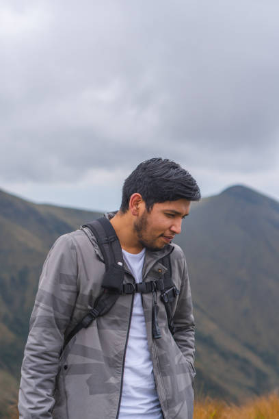 istock Young guy hiking in mountains and enjoying the beautiful view 1459937682