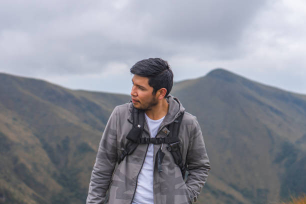 istock Young guy hiking in mountains and enjoying the beautiful view 1459937713