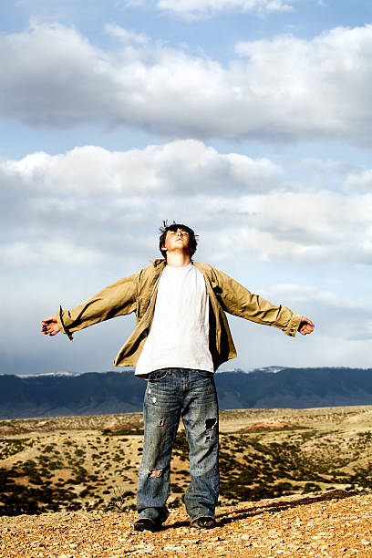 istock freedom - teen with arms wide open 145993857