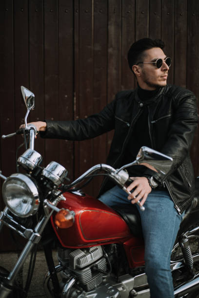 istock One young  handsome man sit on old motorbike 1459939586