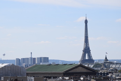 The Eiffel Tower in Paris, France against a blue sky
