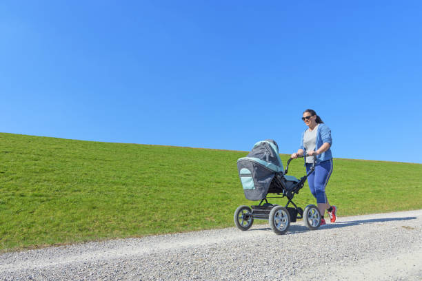 Woman walking with baby buggy