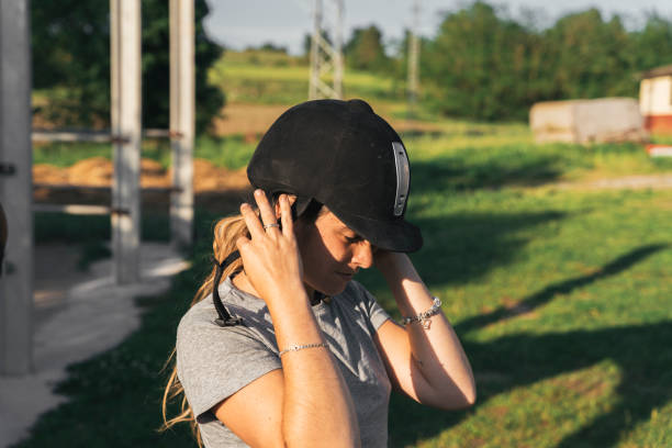 istock Hispanic female rider taking off her helmet 1459940984