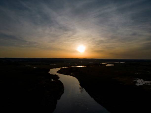 istock Sunset view over the channel with the sun lighting water, cloudy sky background 1459941026