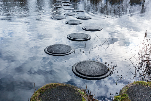 Stepping stones on the water at Amersfoort Nieuwland, The Netherlands