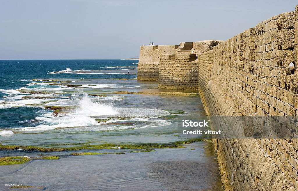 Sea walls of Old Akko Old sea walls of Old Akko with crusaders style stones and fishmans Acco Stock Photo