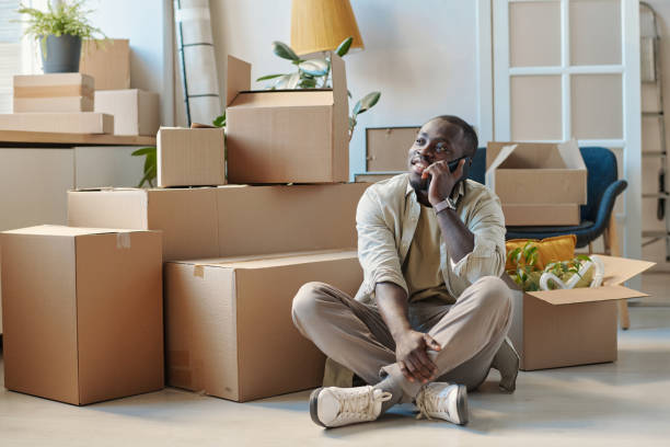 istock Man talking on mobile phone in the room 1459946274