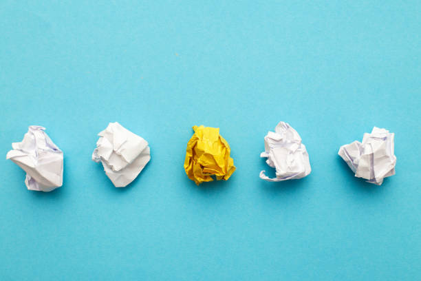 istock crumpled yelllow paper as a concept creative idea and innovation. banner 1459946337