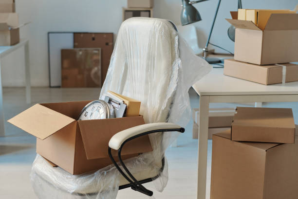 istock Moving to a new office with furniture and boxes 1459946384