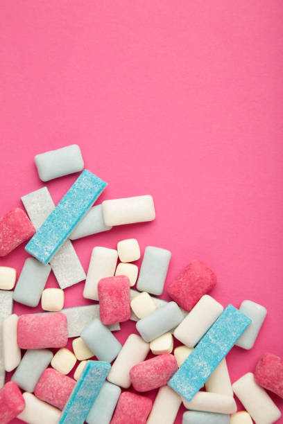 istock Different chewing gums on yellow background. Space for text. Vertical photo 1459946407