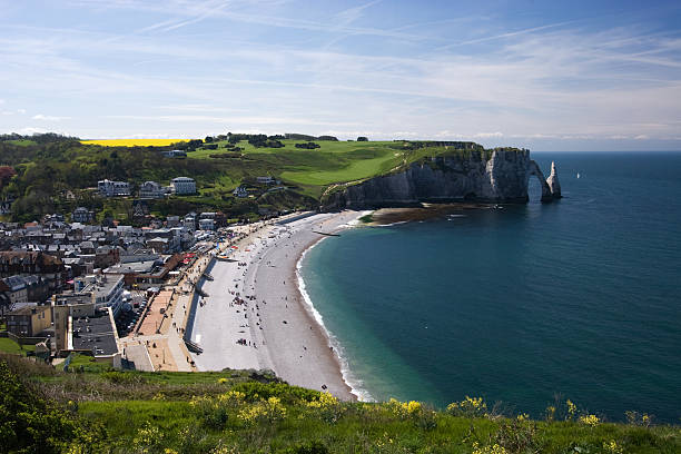 istock A lush green hillside overlooks a cool beach in Etretat 145994891