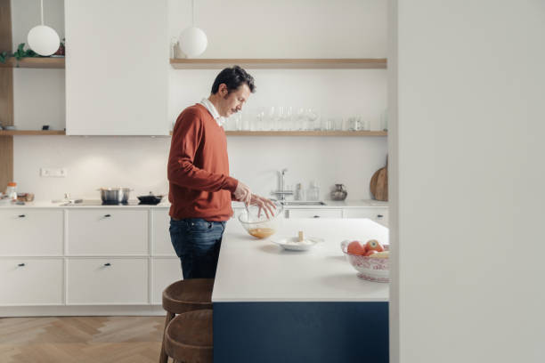 istock Man cooking in the kitchen 1459949808