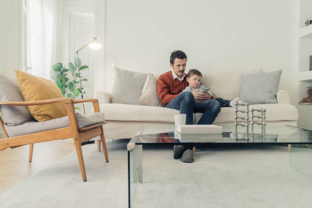 istock Father and son having a video call with cellphone 1459949877