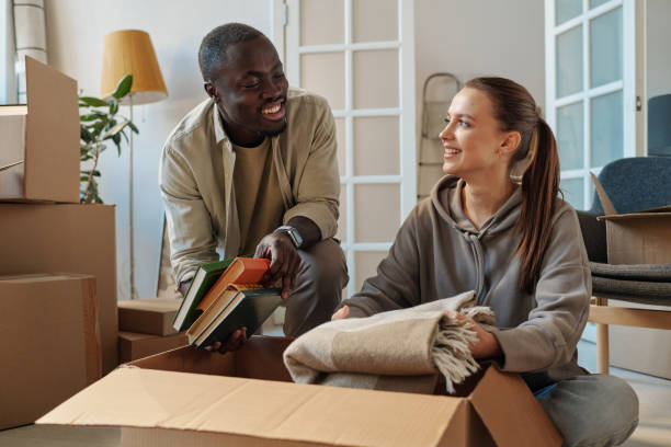 istock Couple unpacking things in the room 1459951164