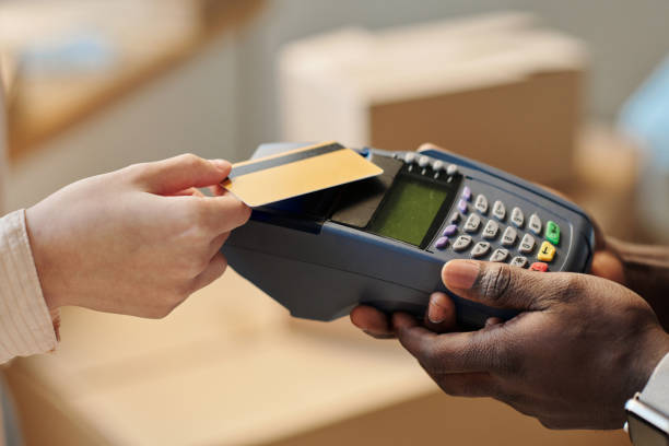 istock Woman using credit card to pay for service 1459951275