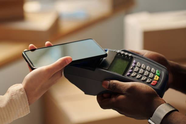 istock Woman paying online with smartphone 1459951319