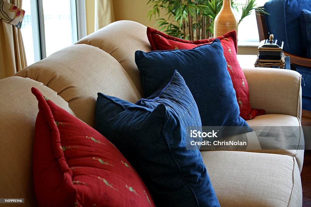 cushions resting on formal couch in modern home Beige Stock Photo