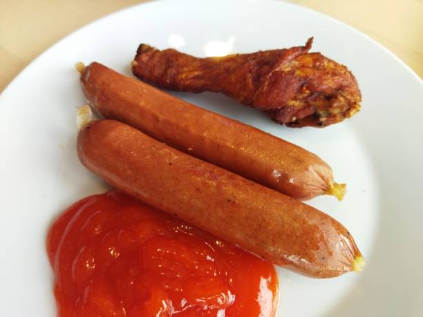 istock Sausages and chicken drum stick 1459953509