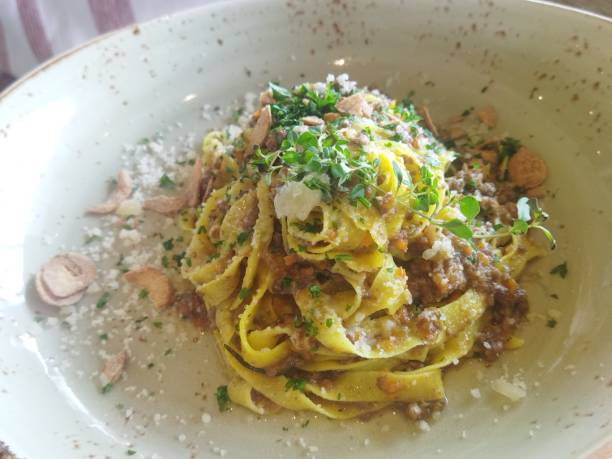 istock Fetuchinni with parmesan and pork meat 1459953924