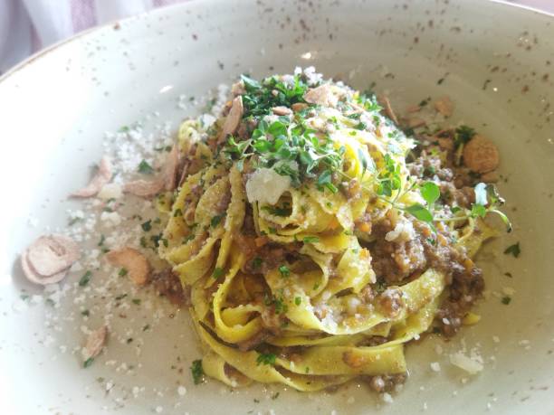 istock Fetuchinni with parmesan and pork meat 1459953932