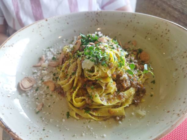 istock Fetuchinni with parmesan and pork meat 1459953937