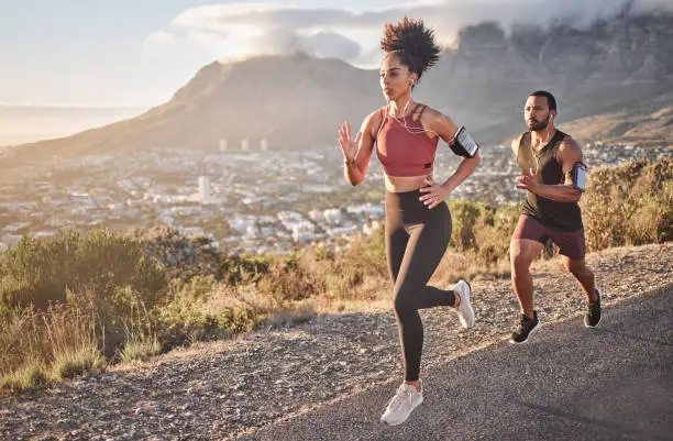 Photo of Fitness, exercise and running couple on mountain for cardio workout, training and energy, healthy lifestyle and strong body wellness. Sports, nature and runner man, woman and athletes action on hill