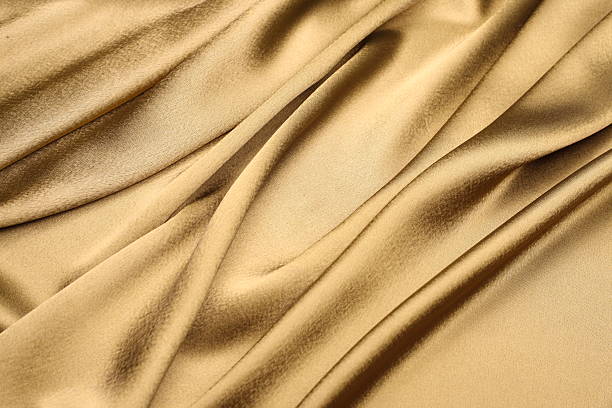 golden satin background stock photo